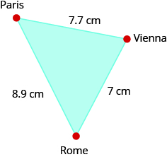 The figure is a triangle formed by Paris, Vienna, and Rome. The distance between Paris and Vienna is 7.7 centimeters. The distance between Vienna and Rome is 7 centimeters. The distance between Rome and Paris is 8.9 centimeters.