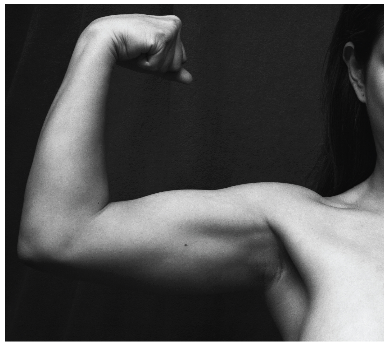 This photo shows a person flexing her biceps.