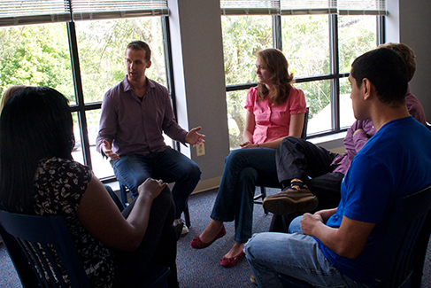 In group therapy, usually 5–10 people meet with a trained therapist to discuss a common issue such as divorce, grief, an eating disorder, substance abuse, or anger management. (credit: Cory Zanker) A group of people arranged in a circle having a conversation is shown.